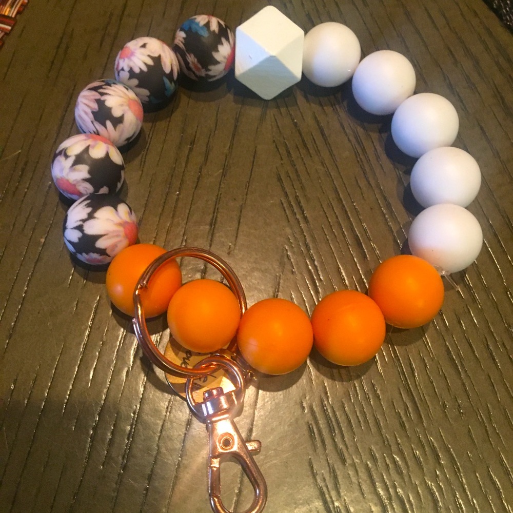 Custom-made bracelet (two)& can be converted to a key chain. Has a bible verse.